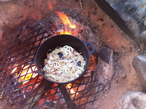 Bacon, onions and rice cooking in a cast iron pan, with maybe just a splash of bourbon.