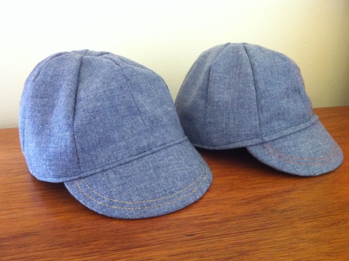 blue cycling caps with contrasting stitching on the brim...